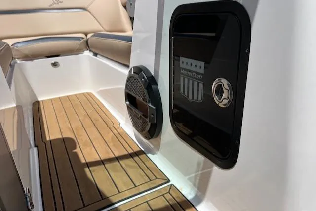 Slide: The Image of 2022 MasterCraft XStar S interior with teak flooring and premium seating. - 19