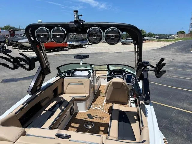 Slide: The Image of 2022 MasterCraft XStar S boat interior with premium seating and advanced audio system. - 9