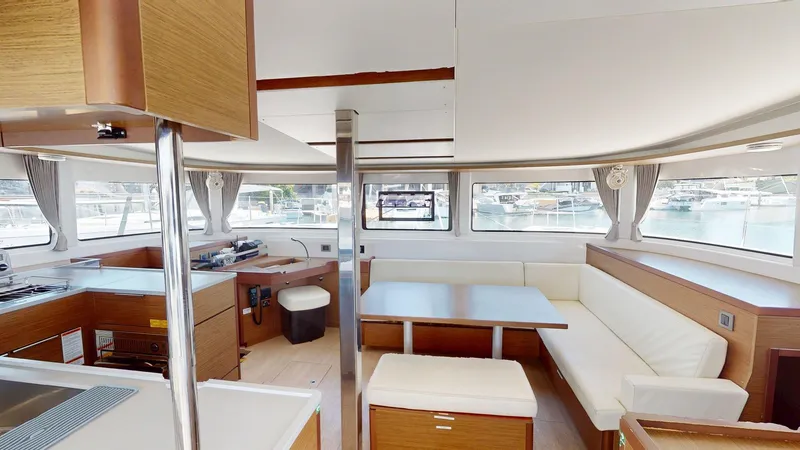 Slide: The Image of Interior of 2020 Lagoon 46 catamaran with modern kitchen and dining area. - 13