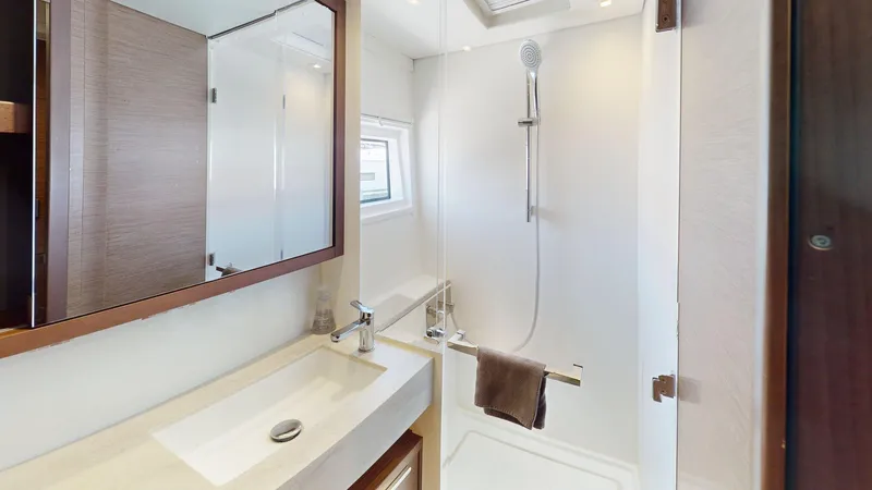 Slide: The Image of Modern bathroom in 2020 Lagoon 46 yacht with shower and sleek vanity. - 27