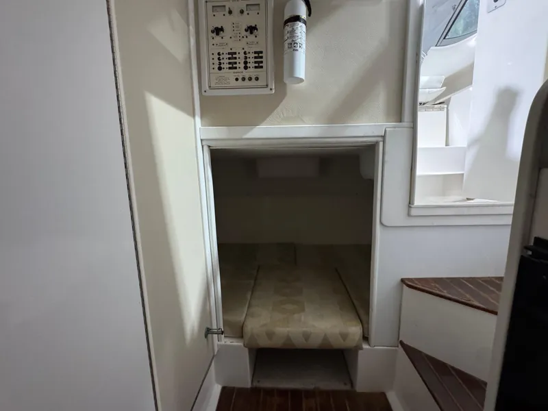 Slide: The Image of 2005 Stamas 310 Express cabin interior with control panel and compact sleeping area. - 25