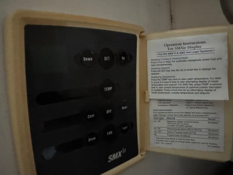 Slide: The Image of SMXir display panel with operation instructions on a 2005 Stamas 310 Express boat. - 26