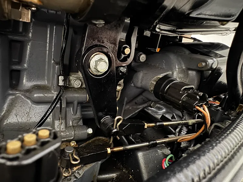 Slide: The Image of Engine components of a 2005 Stamas 310 Express boat, showcasing mechanical details and wiring. - 27