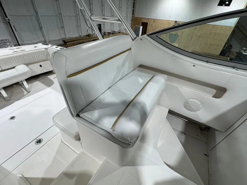 Slide: The Image of 2005 Stamas 310 Express boat interior with white seating and sleek design. - 9