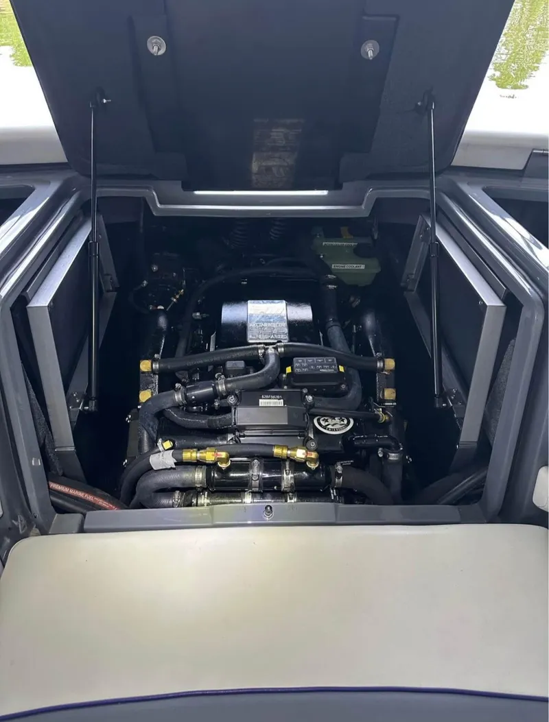 Slide: The Image of Engine compartment of 2020 Malibu Wakesetter 24 MXZ boat, showcasing detailed mechanical components. - 10
