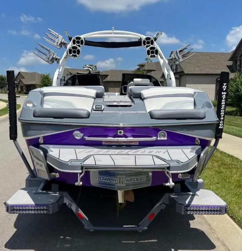 Slide: The Image of 2020 Malibu Wakesetter 24 MXZ boat, rear view, parked in suburban neighborhood. - 3