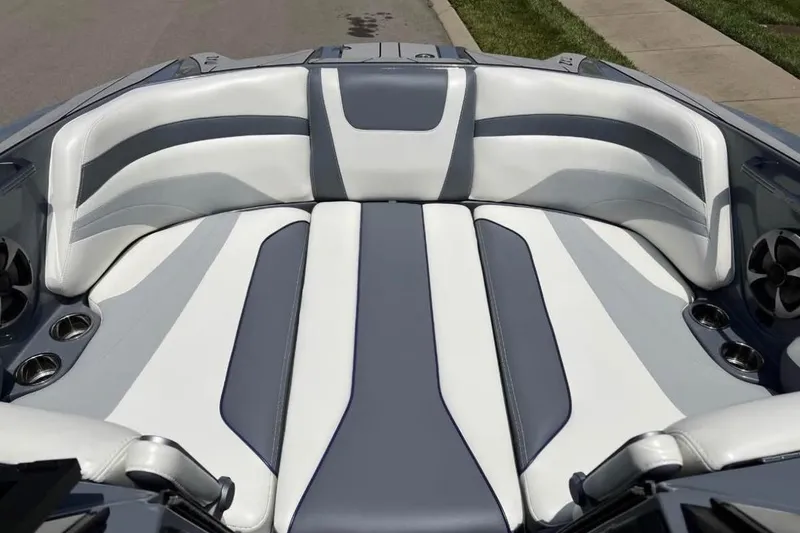 Slide: The Image of 2020 Malibu Wakesetter 24 MXZ interior with gray and white seating. - 4