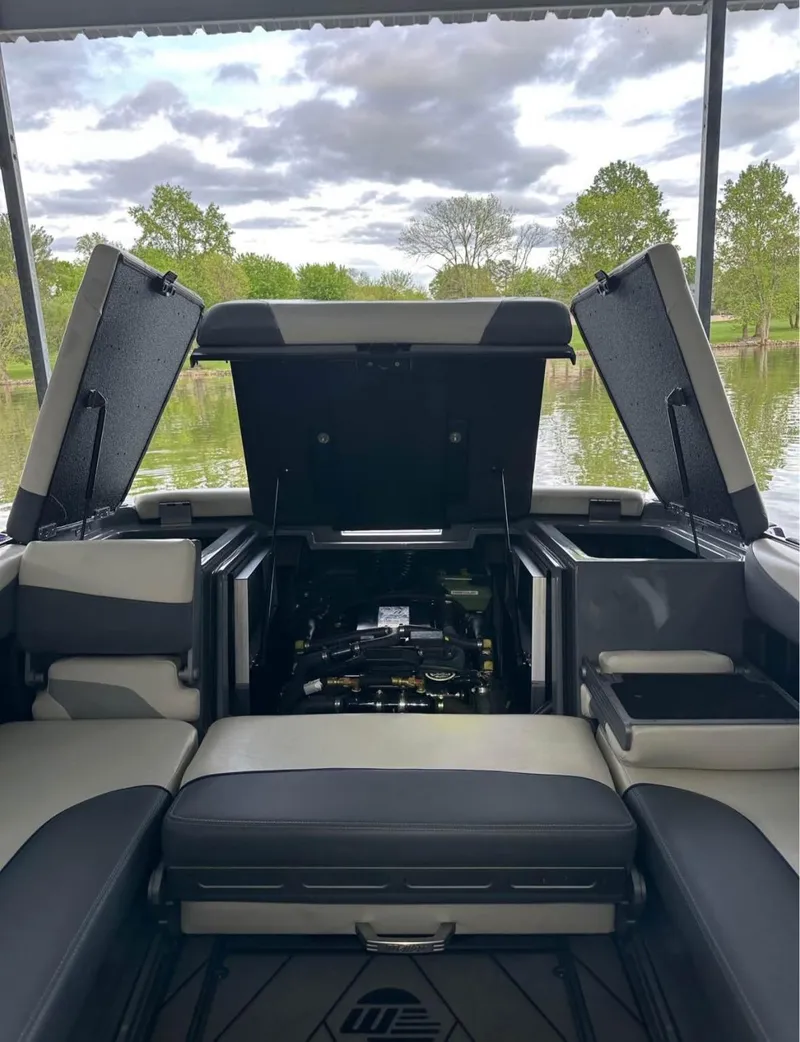 Slide: The Image of 2020 Malibu Wakesetter 24 MXZ interior with open engine compartment, lake view. - 9