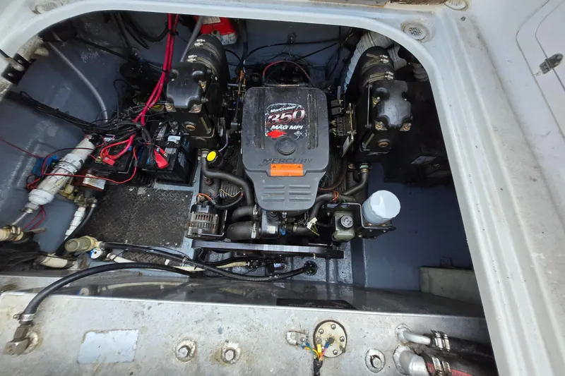 Slide: The Image of Engine compartment of a 2003 Crownline 262 CR boat, featuring a Mercury 350 MAG MPI engine. - 3