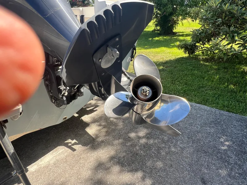 Slide: The Image of Boat propeller of a 2021 Parker 2120, shining in sunlight on a concrete surface. - 3