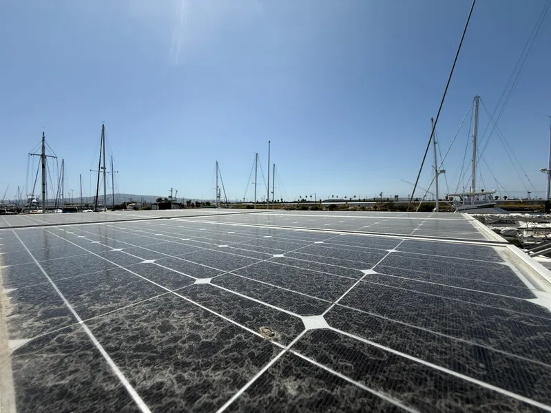 Slide: The Image of Solar panels on a 1985 Nauticat 43 sailboat under clear blue sky. - 14
