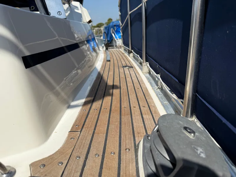 Slide: The Image of Teak deck of 1985 Nauticat 43 sailboat with stainless steel railing. - 7