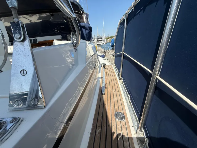 Slide: The Image of Nauticat 43 sailboat deck with wooden flooring and blue canvas, 1985 model. - 8