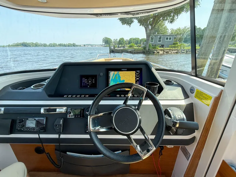 Slide: The Image of Interior view of 2021 Axopar 28 CABIN boat cockpit with navigation system. - 18