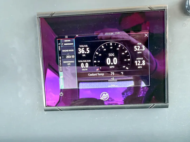 Slide: The Image of Dashboard display of a 2021 Axopar 28 CABIN showing fuel and speed metrics. - 24