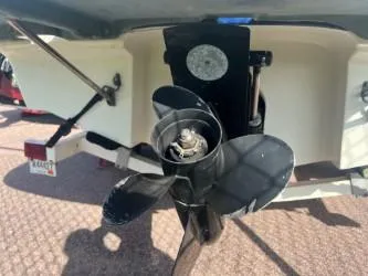 Slide: The Image of 2005 Bayliner 205 Bowrider boat propeller and stern view. - 5