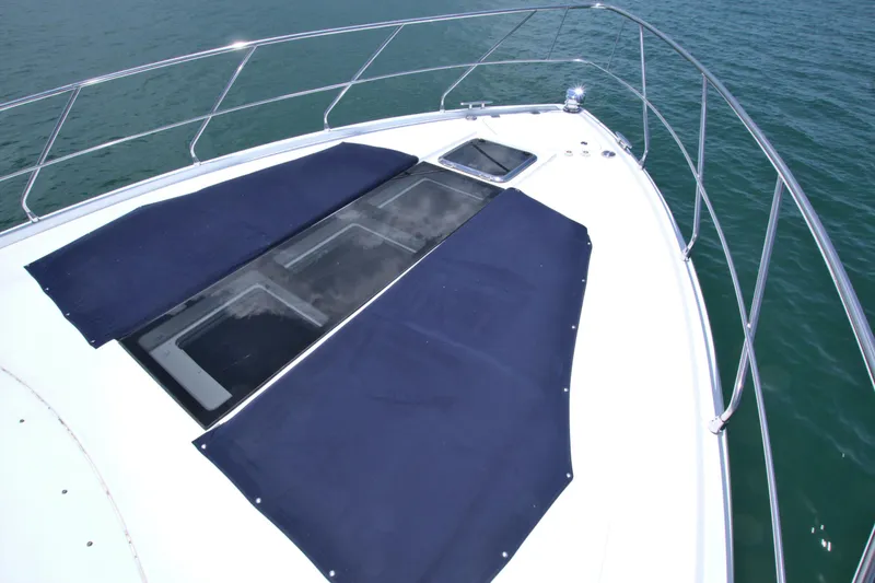 Slide: The Image of Bow of 2018 Cruisers Yachts 54 Fly with sun pads and railing. - 23