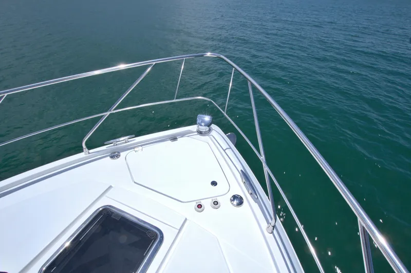 Slide: The Image of Bow of 2018 Cruisers Yachts 54 Fly on calm water. - 24