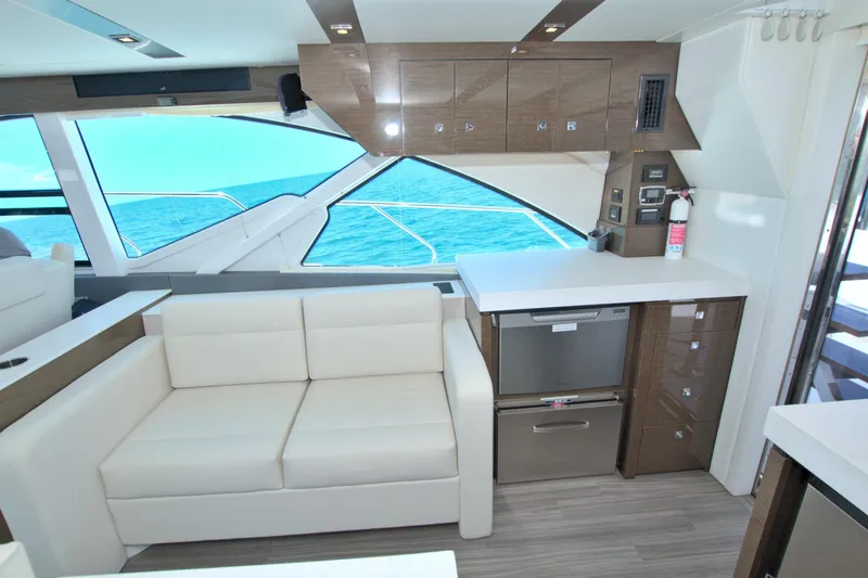 Slide: The Image of Luxurious interior of 2018 Cruisers Yachts 54 Fly with modern kitchen and ocean view. - 35