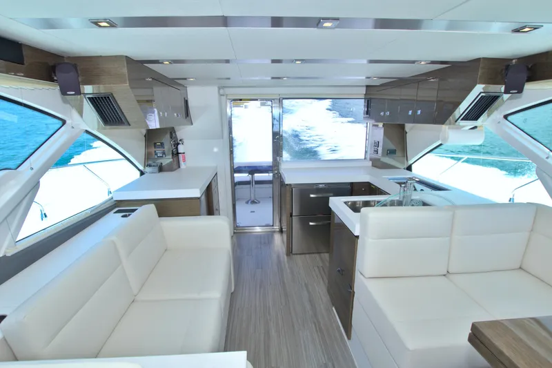 Slide: The Image of Luxurious interior of 2018 Cruisers Yachts 54 Fly with modern kitchen and seating. - 36