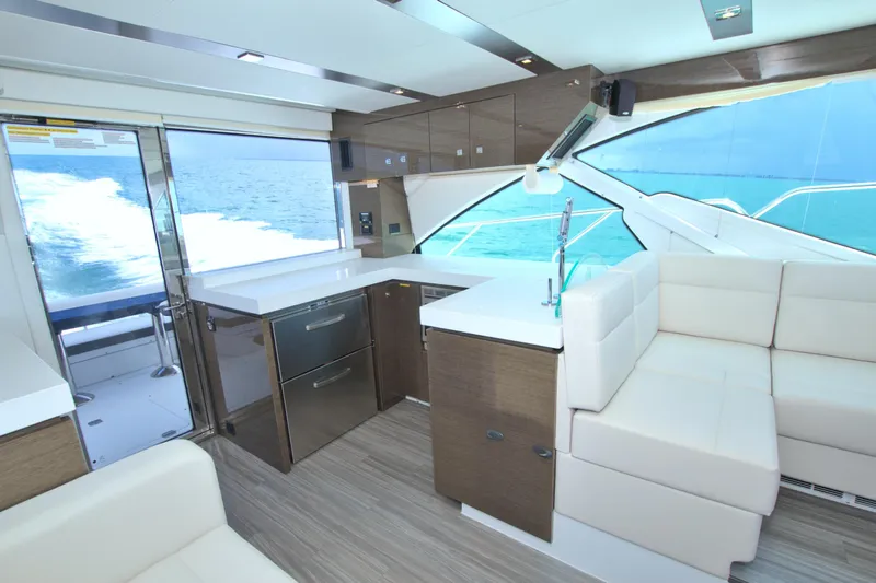 Slide: The Image of Luxurious interior of 2018 Cruisers Yachts 54 Fly with modern kitchen and ocean view. - 37