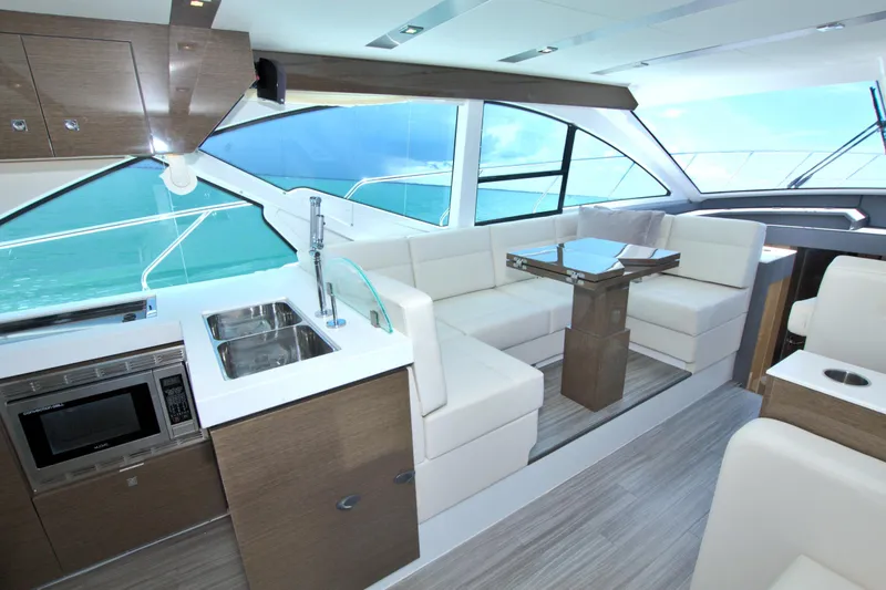 Slide: The Image of Luxurious interior of 2018 Cruisers Yachts 54 Fly with modern kitchen and seating area. - 39