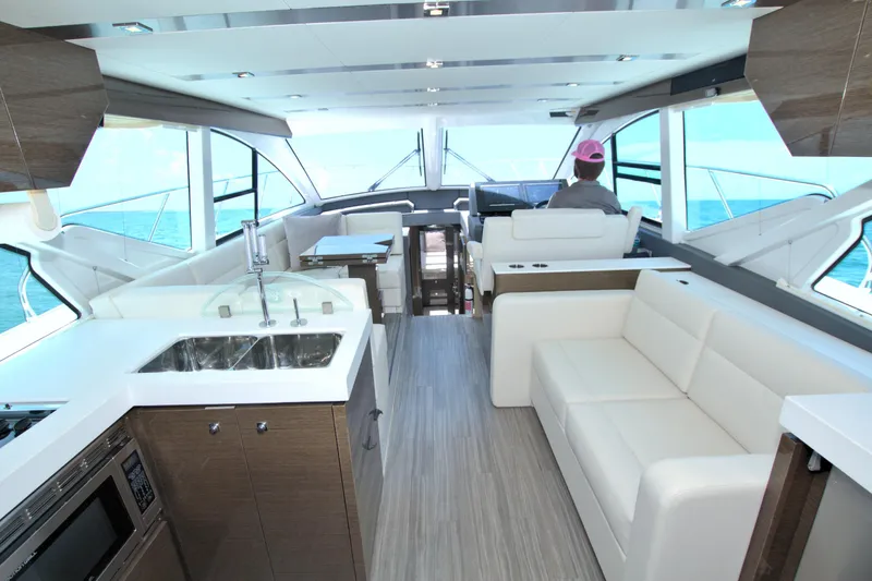 Slide: The Image of Luxurious interior of 2018 Cruisers Yachts 54 Fly with modern kitchen and seating. - 40