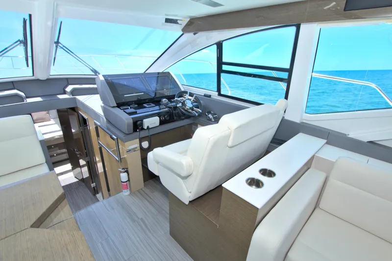 Slide: The Image of Luxurious interior of 2018 Cruisers Yachts 54 Fly with modern helm and ocean view. - 42