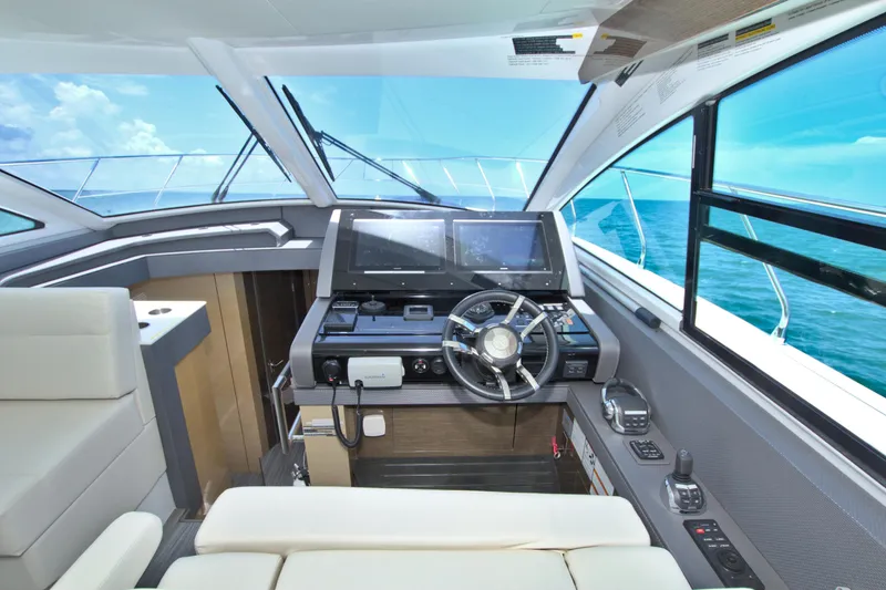 Slide: The Image of 2018 Cruisers Yachts 54 Fly helm with modern controls and ocean view. - 44