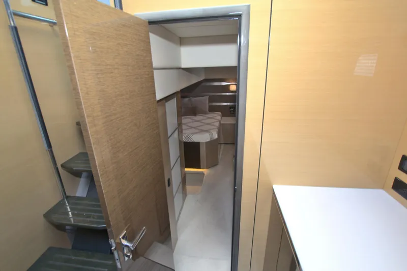 Slide: The Image of 2018 Cruisers Yachts 54 Fly interior with modern design and cozy bedroom. - 49