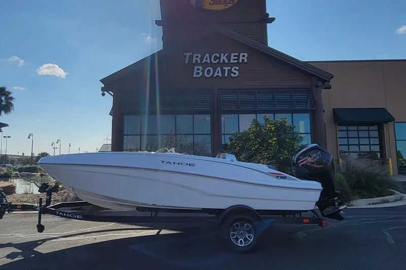 The Image of 2025 Tahoe T18 boat on trailer outside Tracker Boats store. - 0