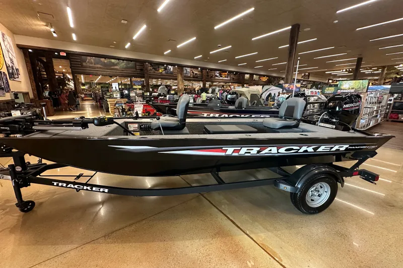 The Image of 2025 Tracker Panfish 17 boat displayed indoors, featuring sleek design and modern amenities. - 2