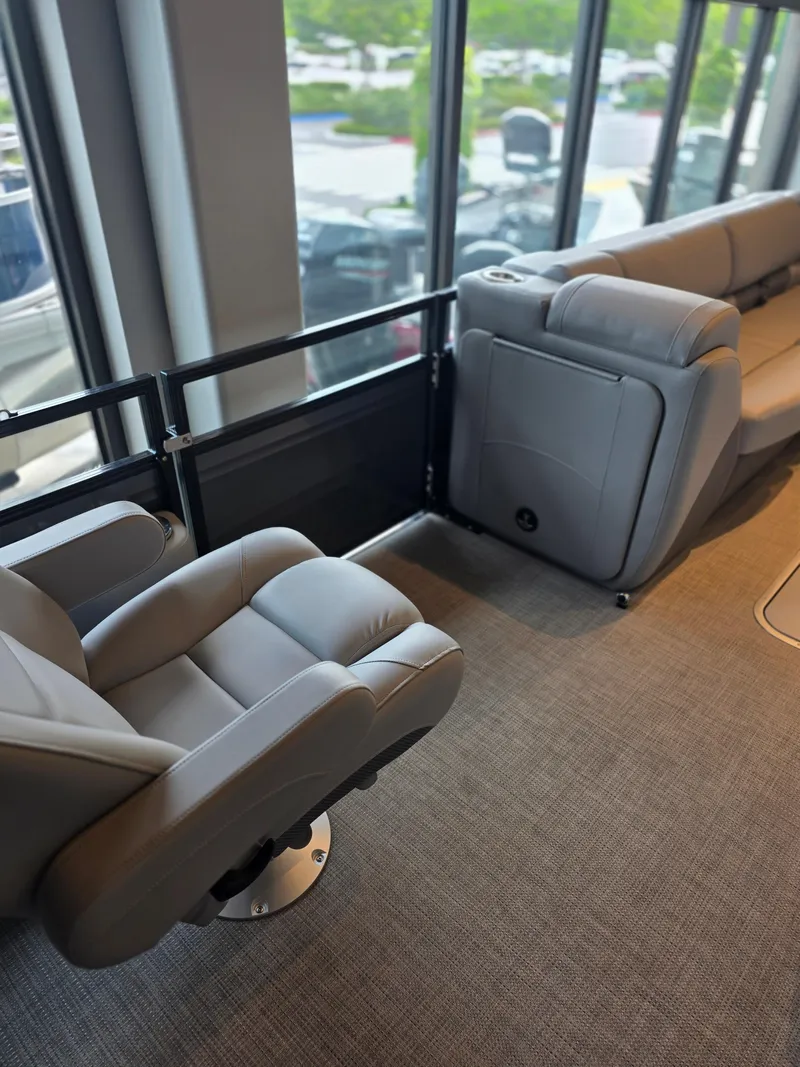 Slide: The Image of Luxurious interior of 2025 Regency 250 LE3 boat with plush seating and panoramic windows. - 4