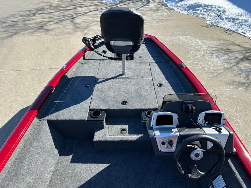 Slide: The Image of 2025 Tracker Pro Team 175 boat interior with steering wheel and control panel. - 4