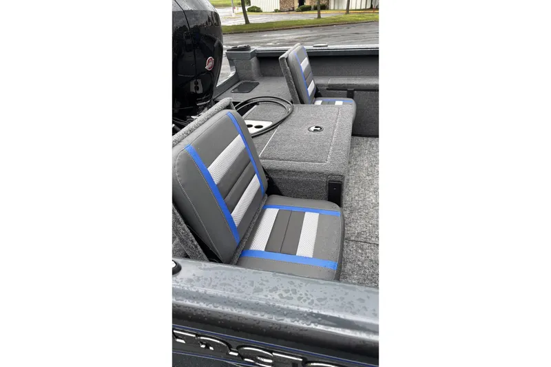 Slide: The Image of 2025 Ranger VS1882SC Reata boat interior with gray and blue seating. - 6
