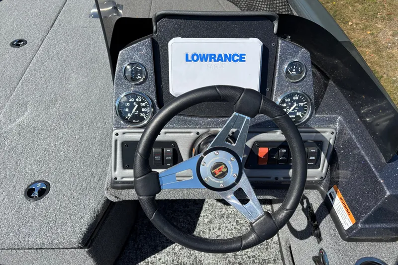 Slide: The Image of 2025 Ranger VS1882SC Reata boat dashboard with steering wheel and Lowrance display. - 5