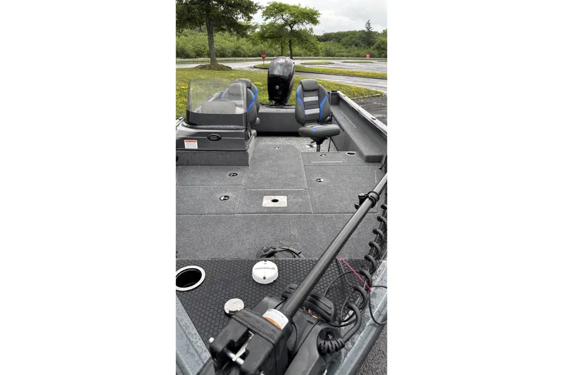 The Image of 2025 Ranger VS1882SC Reata boat interior with seating and equipment, parked outdoors. - 0
