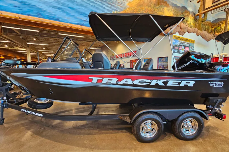 The Image of 2025 Tracker Targa V-19 WT boat displayed indoors on a trailer. - 0