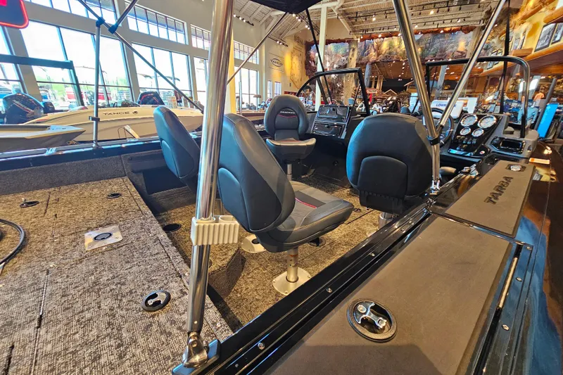 Slide: The Image of 2025 Tracker Targa V-19 WT boat interior with seating and control panel. - 2