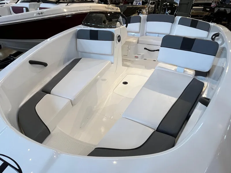 Slide: The Image of 2025 Tahoe T16 boat interior with white and gray seating, showcasing spacious design. - 3