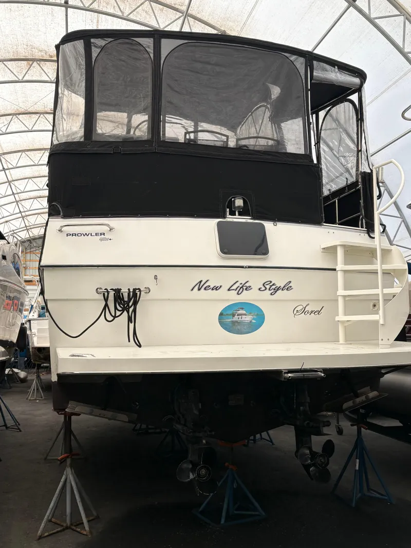 Slide: The Image of 1988 Cooper Prowler boat in storage, featuring "New Life Style" on the stern. - 1