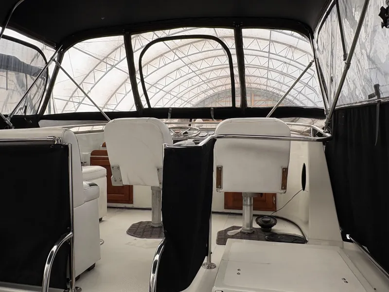 Slide: The Image of 1988 Cooper Prowler boat detail in marina, featuring railing and cover. - 17