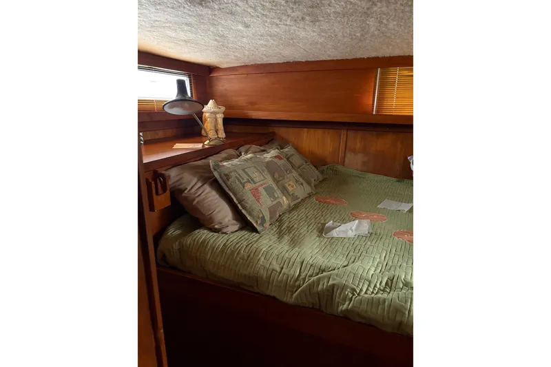 Slide: The Image of 1988 Cooper Prowler boat helm with steering wheel, gauges, and controls. - 27