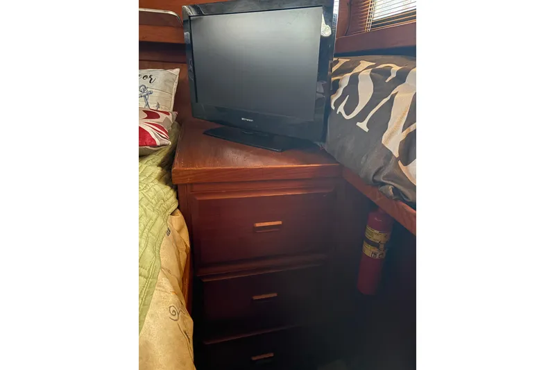 Slide: The Image of Small TV on wooden cabinet in cozy 1988 Cooper Prowler interior. - 38