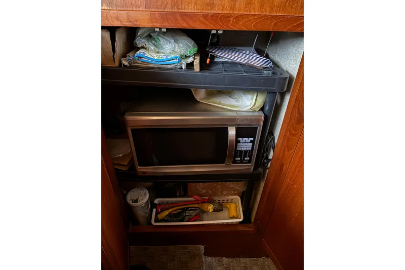 Slide: The Image of 1988 Cooper Prowler interior with microwave and storage shelves. - 41