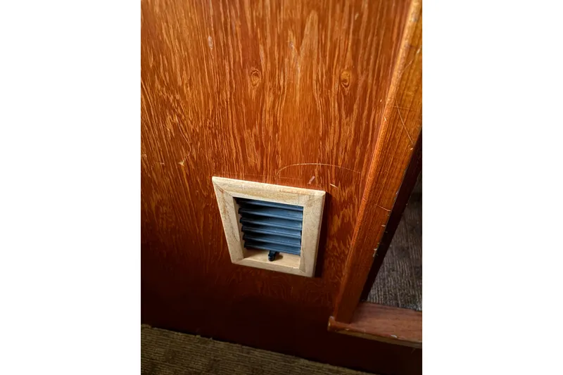 Slide: The Image of Wooden panel with a small vent, Cooper Prowler 1988 interior detail. - 42