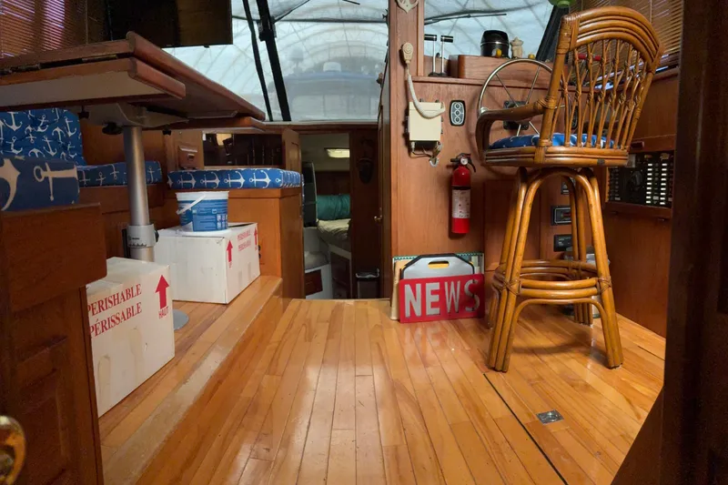 Slide: The Image of Interior of 1988 Cooper Prowler boat with wooden flooring and nautical-themed decor. - 43