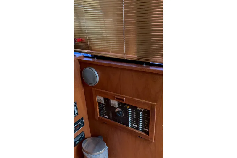 Slide: The Image of 1988 Cooper Prowler interior with control panel and speaker, featuring wooden finish and blinds. - 44