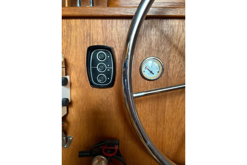 Slide: The Image of 1988 Cooper Prowler dashboard with steering wheel and fuel gauge. - 49