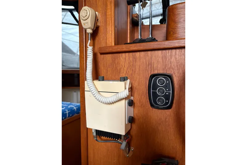 Slide: The Image of 1988 Cooper Prowler boat interior with vintage radio and control panel. - 50